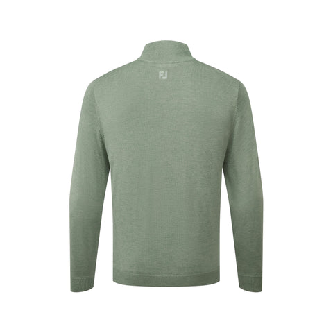 Un jersey de manga larga y cremallera de un cuarto de longitud en color verde salvia, visto desde atrás, con un pequeño logotipo blanco «FJ» cerca de la parte superior central, sobre un fondo blanco liso.