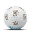 TaylorMade TP5 Pix Oktoberfest golf balls featuring pretzel design, premium quality, ideal for golf enthusiasts.