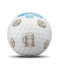 TaylorMade TP5 Pix Oktoberfest golf balls with pretzel design, premium quality, showing colorful golf ball featuring Oktoberfest-themed graphics.