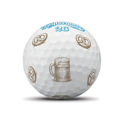 TaylorMade TP5 Pix Oktoberfest golf balls with pretzel design, premium quality, showing colorful golf ball featuring Oktoberfest-themed graphics.